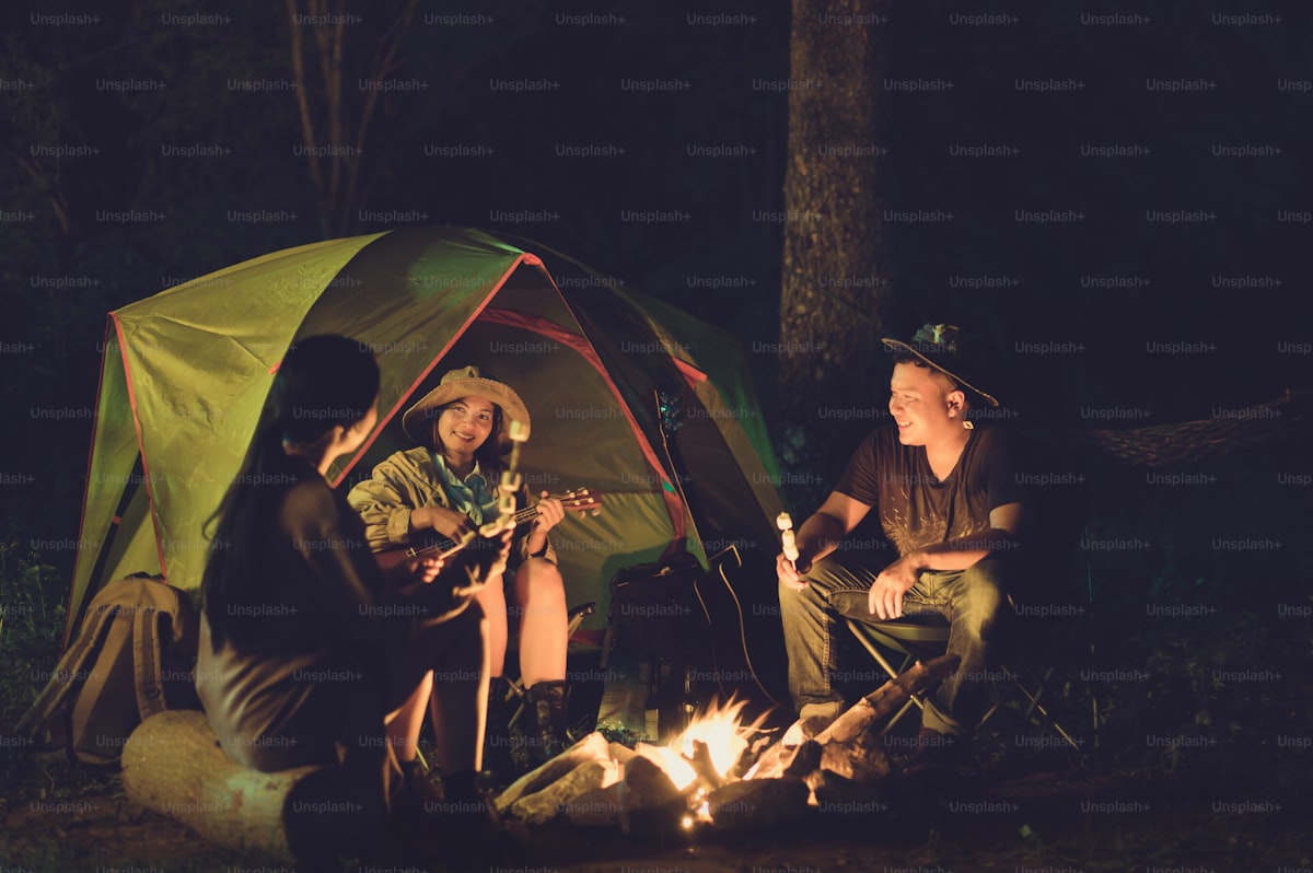 Portable camping fan running inside a tent at night