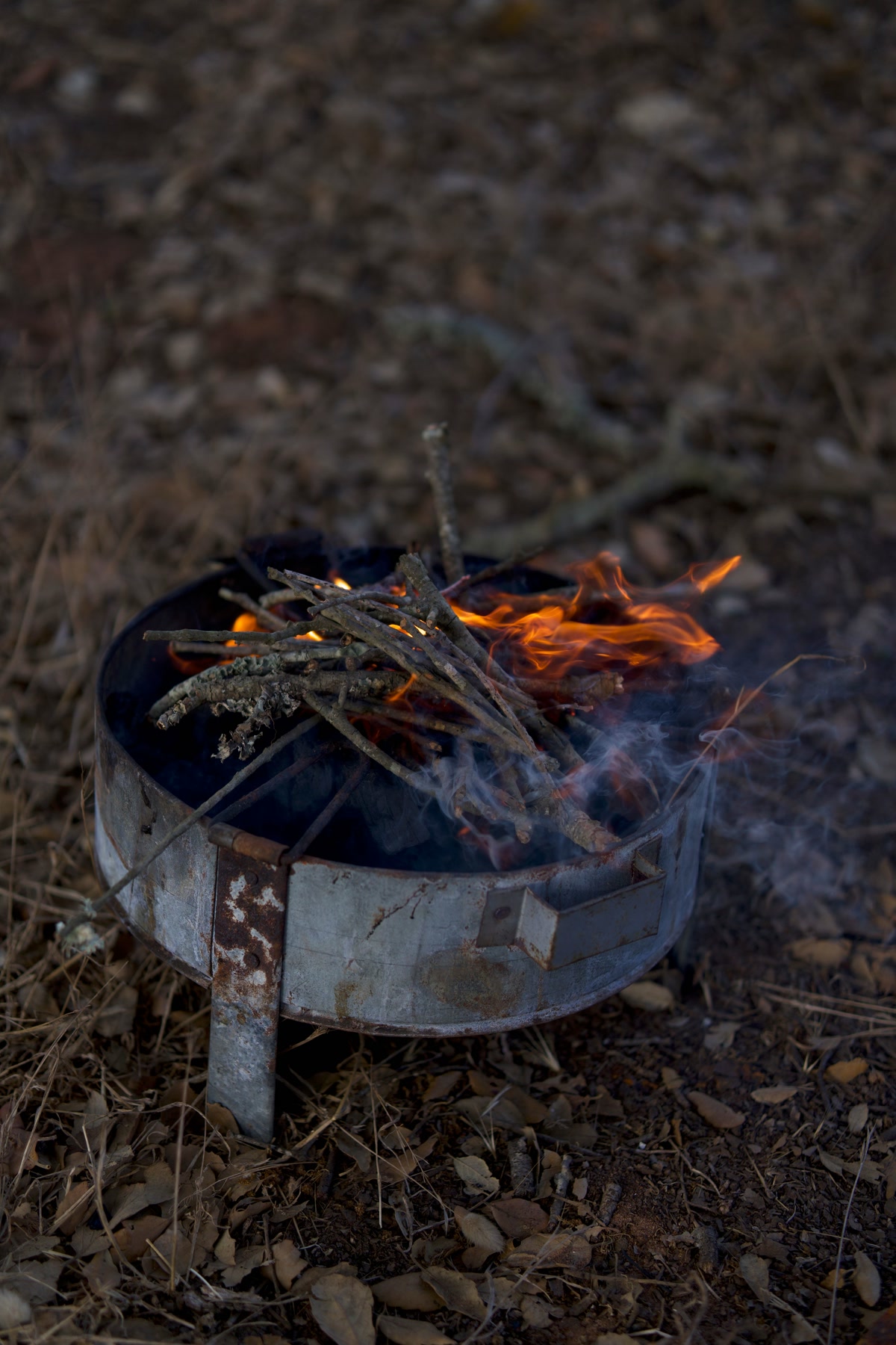 Close-up of natural fire starter squares burning with small flames