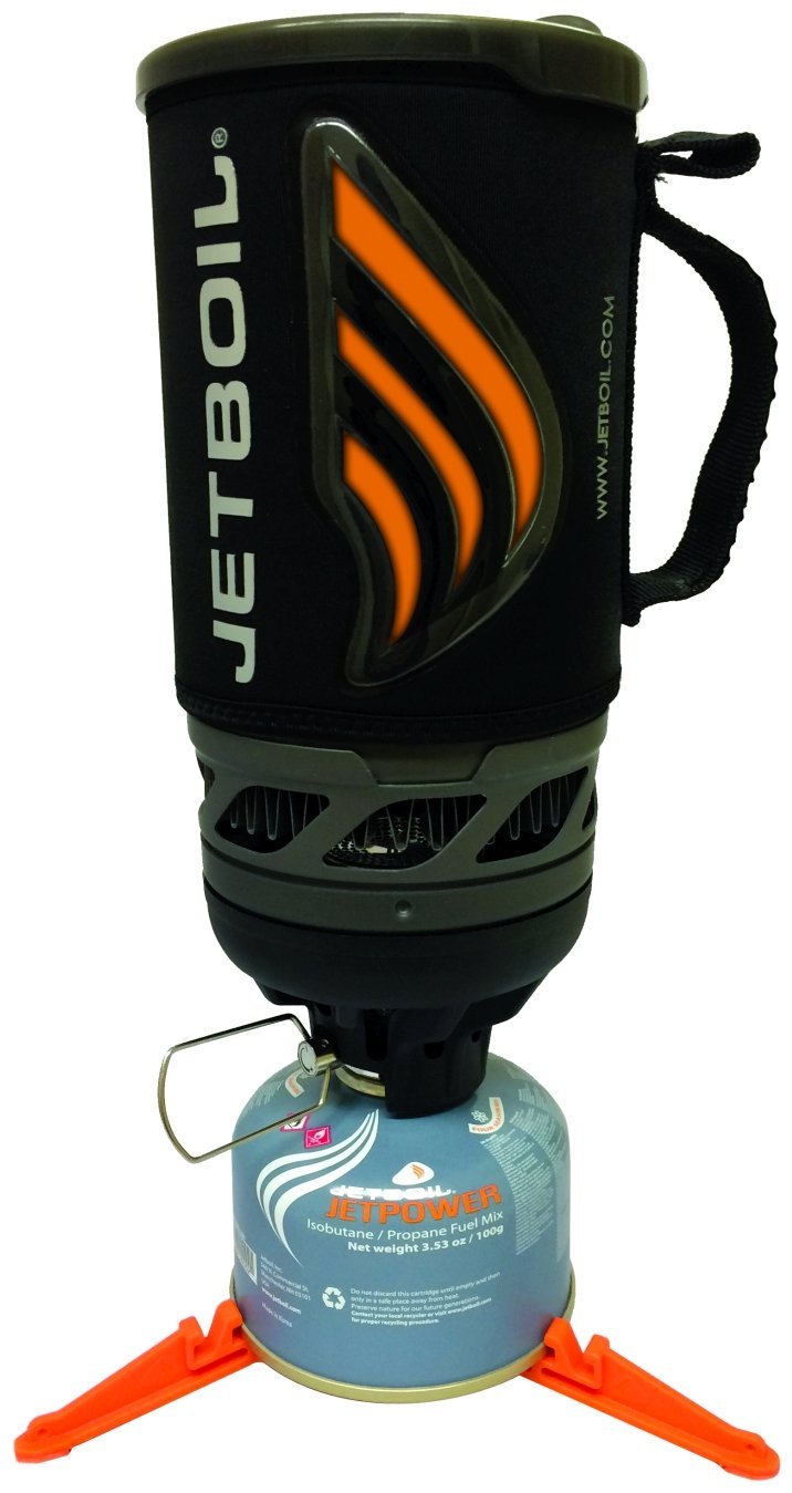 AeroPress Go coffee maker being used at a backcountry campsite with a camping stove and mug