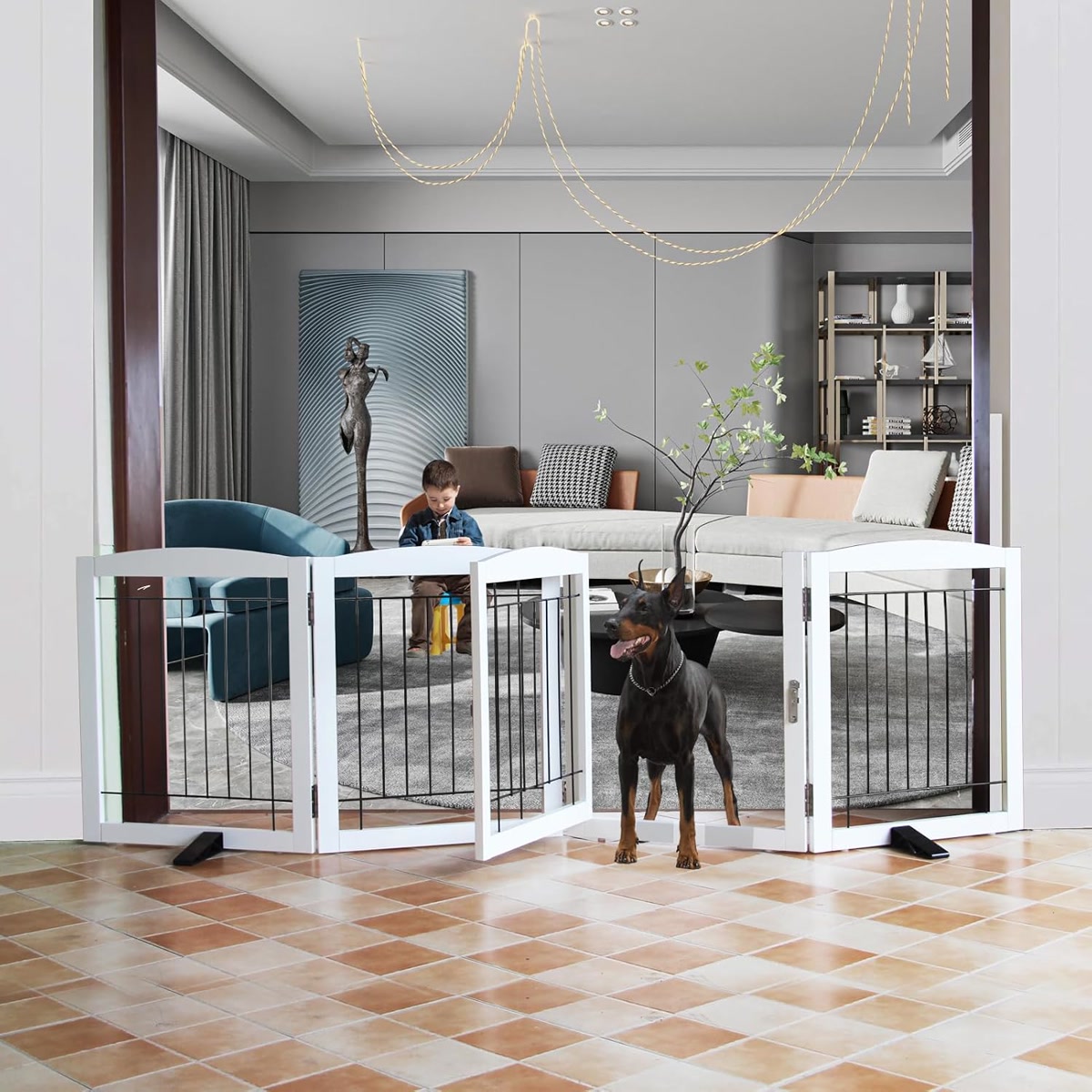A well-behaved dog sitting behind an attractive wooden freestanding pet gate in a modern home doorway, warm interior light, the gate blending with home decor