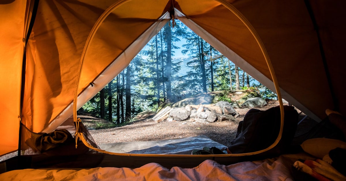 Down sleeping bag inside a backcountry tent at sunrise