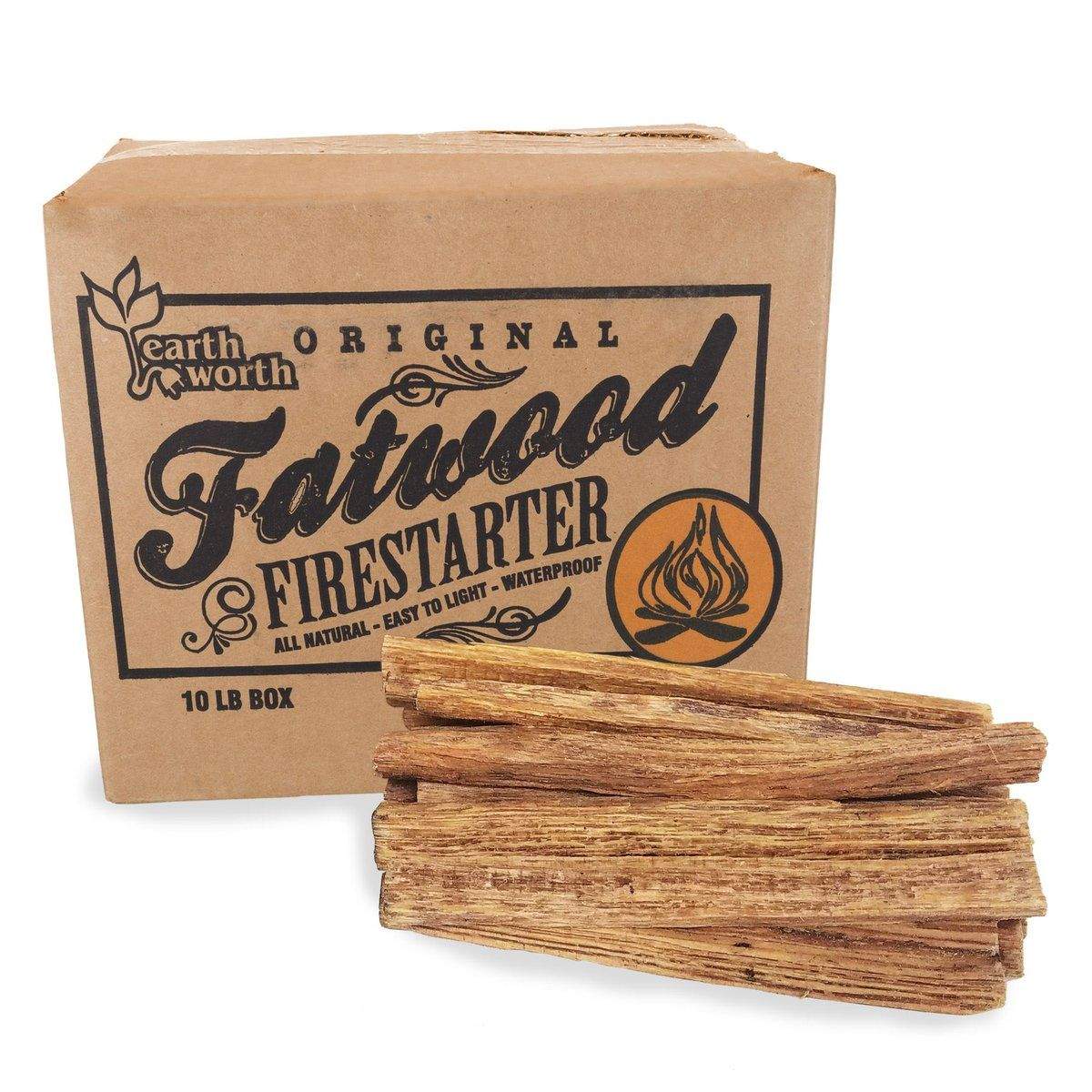Fatwood sticks with shavings curled on a wooden camp table