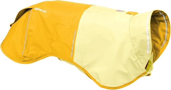 Ruffwear Sun Shower dog raincoat in mineral yellow on a hiking trail